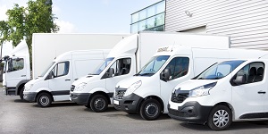 fleet of white commercial vehicles